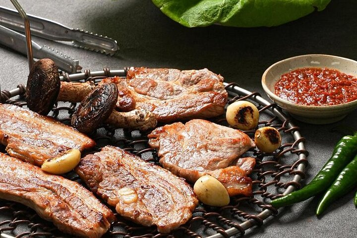 Savor the delicious flavors of Korean BBQ while grilling succulent meats right at your table. Experience the culinary culture of Busan complemented by breathtaking views from the Oryukdo Skywalk.